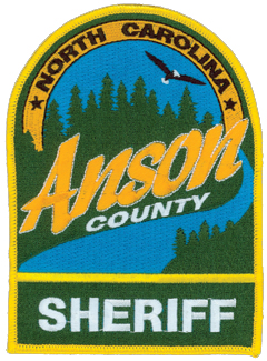 Anson County, North Carolina is located on the southern border of the state and makes up 553 square miles of rural countryside. Established in 1750, the county initially stretched from the Atlantic Ocean to the Mississippi River. The patch of the Anson County Sheriff’s Office depicts a vast pine forest amidst a wide open, blue sky and one of the rivers that border the county. Also featured is a soaring bald eagle, often found along the area’s rivers.