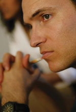 Pensive Man With Hands Clasped Near Chin (Stock Image)