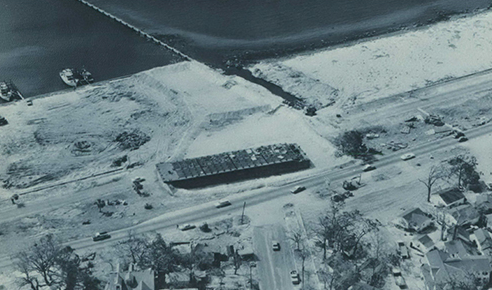 Hurricane Camille smashed into the Mississippi Gulf Coast on Sunday night, August 17, 1969. A barge pushed onto U.S. Highway 90 by the winds and high tides was refloated by means of a dike lined with plastic.