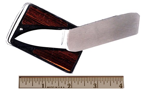 This item appears to be a belt buckle but actually is a knife blade. The blade folds under the handle, which can be stored in the front of the belt buckle. Law enforcement officers should be aware that offenders may attempt to use this unusual weapon.