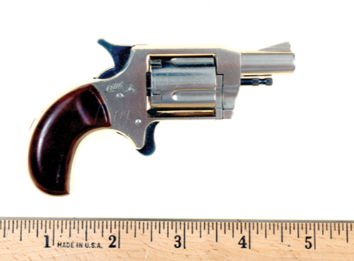 This small metal revolver is released from a belt buckle by the press of a button. Offenders may attempt to use this concealed weapon against law enforcement.