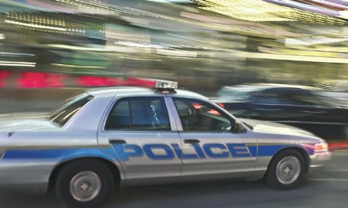 Blurred Police Car in Motion (Stock Image)