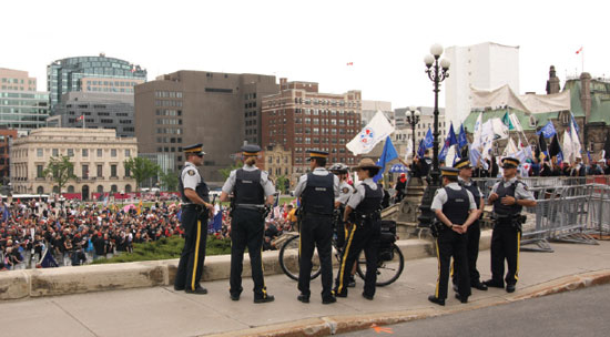 Canadian Police Officers in Front of Crowd