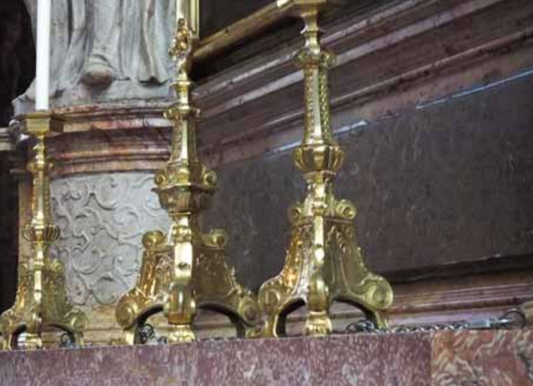 Chained altar pieces demonstrate the threat of theft in houses of worship.