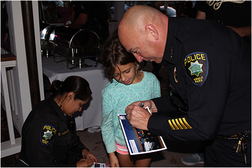 Chief Jonsen and Officer Alcaraz Signing Autographs