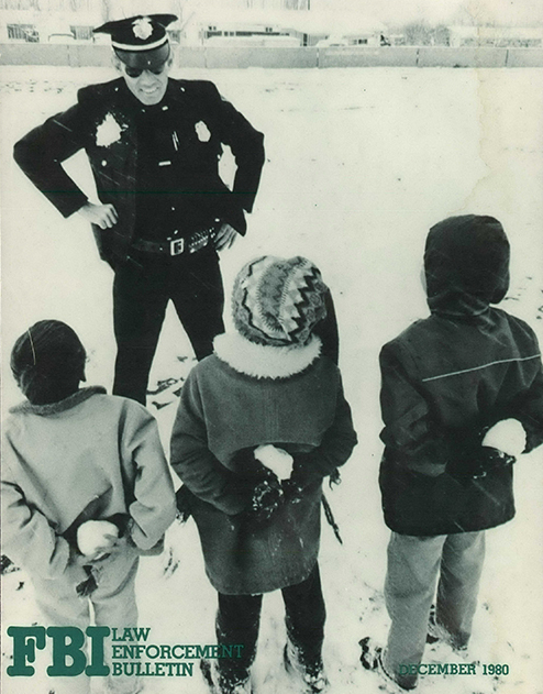 Children Playing in Snow and Talking to Police Officer (December 1980)