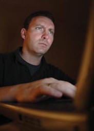 Man Looking at Computer (Stock Image)