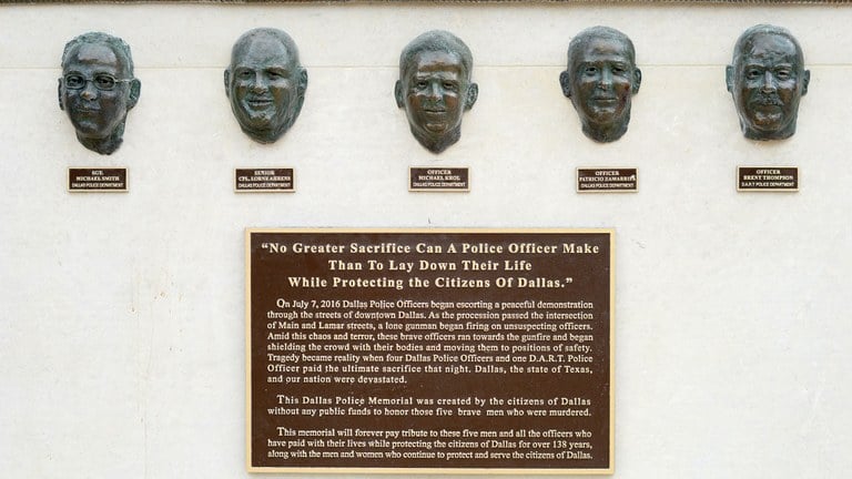 An close up image of the faces of five law enforcement officer memorialized on the 7|7 Monument, Dallas, Texas.