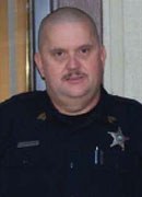 Fairfield Glade, Tennessee Police Department Public Safety Officer Jeff Fitzgerald saved a family of three from a house fire. He was a Bulletin Notes recipient in December 2010.