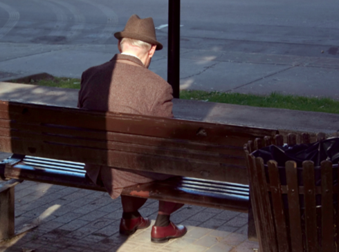 Elderly Man Sitting on Bench