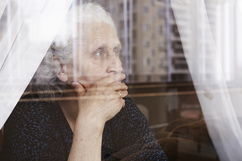 Elderly Woman Looking Out Window (Stock Image)