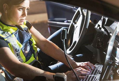 Officer on Car Laptop