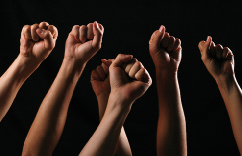 Fists in the Air (Stock Image)