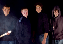 Four Men in Dark Clothes (Stock Image)
