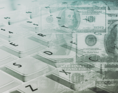 Cash and Computer Keyboard (Stock Image)