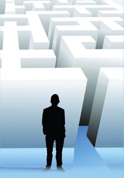 Silhouette of Man Standing Outside White Maze (Stock Image)