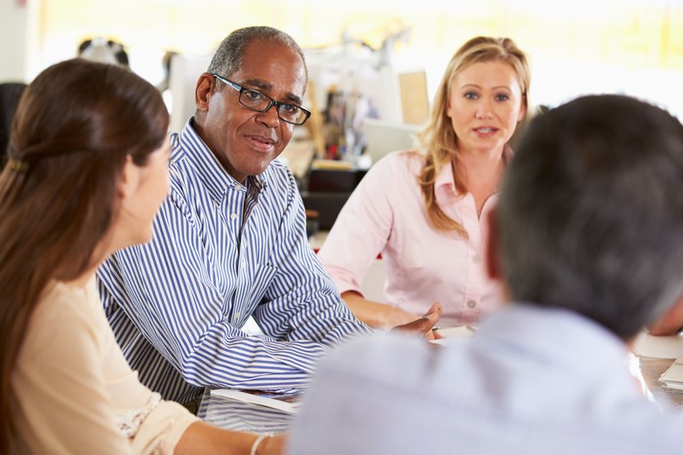 A stock image of a group of people talking.