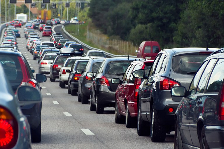 A stock image of traffic backed up on a highway.