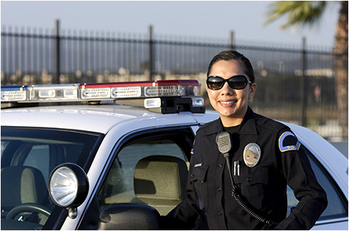 Female Police Officer Next to Vehicle