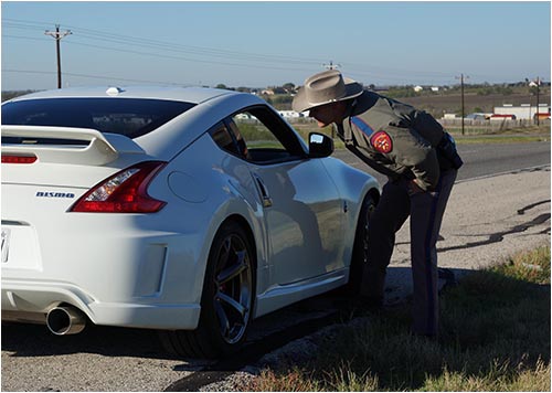 Texas Department of Public Safety Officer Talks to Driver (Stock Image)