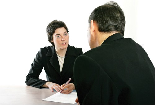 Woman Interviewing Man (Stock Image)