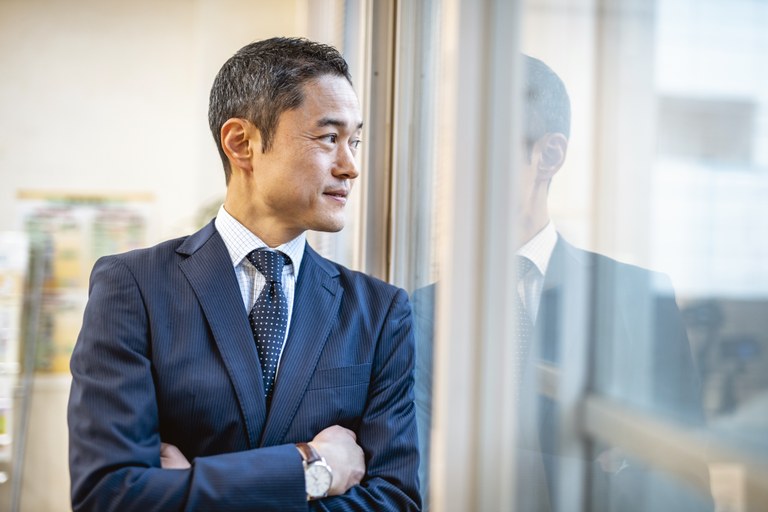 A stock image of a businessman in an office setting.