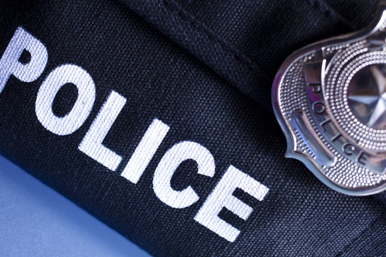 A stock image of a police badge on a police uniform.