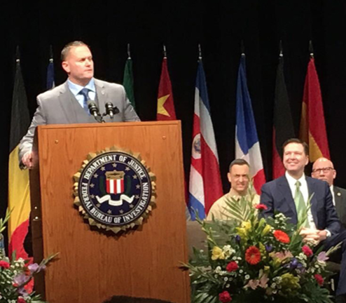 Assistant Chief Taylor of the Dallas-Fort Worth, Texas, Airport Police Department delivers a speech at the FBI National Academy Session 267 graduation on March 17, 2017, in Quantico, Virginia.