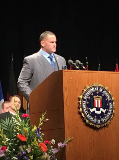 Assistant Chief Taylor of the Dallas-Fort Worth, Texas, Airport Police Department delivers a speech at the FBI National Academy Session 267 graduation on March 17, 2017, in Quantico, Virginia.
