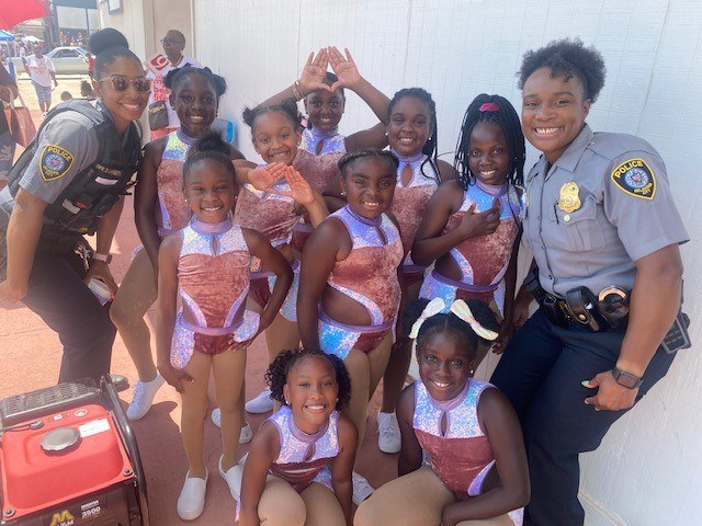 Kids pictured with and officers from the Oklahoma Police Departments FACT outreach program.