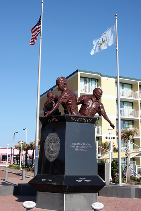 The Virginia Beach Law Enforcement Memorial was dedicated on June 23, 2012. The memorial was created by Paul DiPasquale, the same sculptor who created Virginia Beach’s iconic statue of King Neptune. It features three police officers, sculpted in bronze, who represent the Virginia Beach Police Department, Virginia Beach Sheriff’s Office, and state and federal law enforcement agencies.