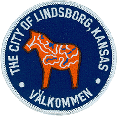 On the left sleeve of the Lindsborg, KS, Police uniform is the city of Lindsborg seal, prominently featuring the Dala horse. 