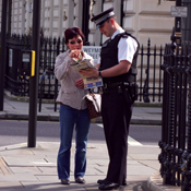 London Police Officer Helping Civilian