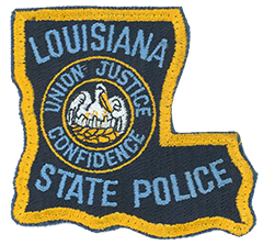 The Louisiana State Police was created in 1936 when the state legislature combined the highway patrol with the bureau of criminal investigation. The shoulder patch of the Louisiana State Police dates back to its founding year. Its patch forms the “boot,” or “L,” shape of the state. The department is one of only four state police agencies nationwide to fashion its patch in the outline of the state it serves. Within the patch is the Louisiana State Seal, featuring a pelican—the state bird—in a nest feeding three of its young. Surrounding the seal are the words “Union, Justice, Confidence,” the state motto