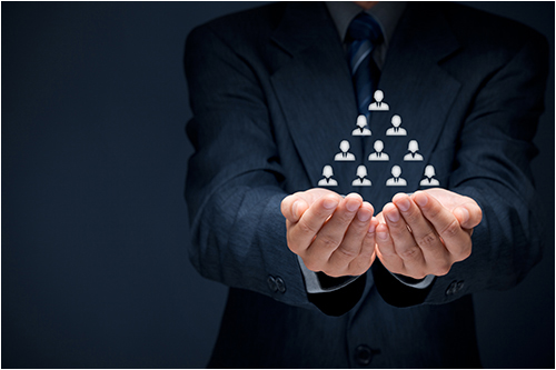 Man Holding a Triangle (Stock Image)