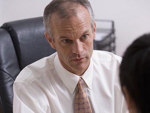 Man Conducting an Interview (Stock Image)