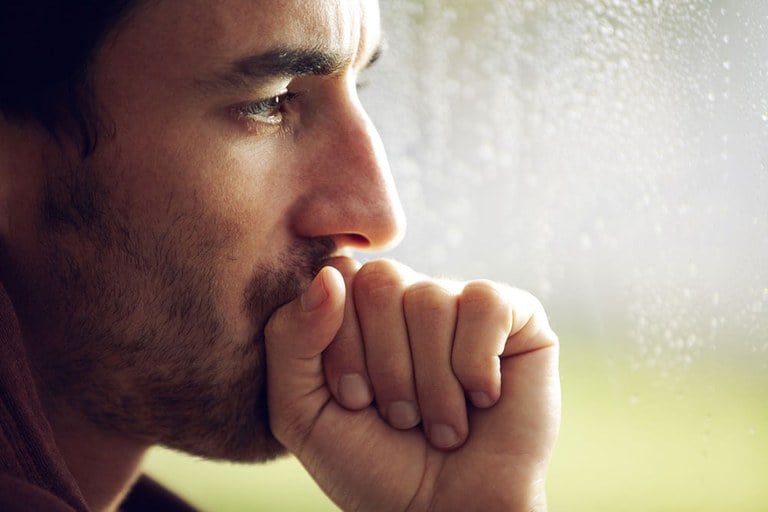 A stock image of a middle-aged man thinking.