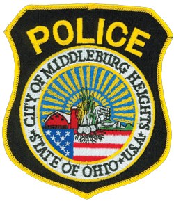 Sixty years ago, the area encompassing Middleburg Heights, Ohio, was largely farmland. The city’s police department patch, with its red barn and onions in the middle, represents this agrarian past. The modern day office building to the right reflects the area’s growth into a progressive, suburban Cleveland community. The sun and sunbeams in the background are taken from The Great Seal of the State of Ohio, while the American flag at the base represents the city’s deep rooted nationalism.