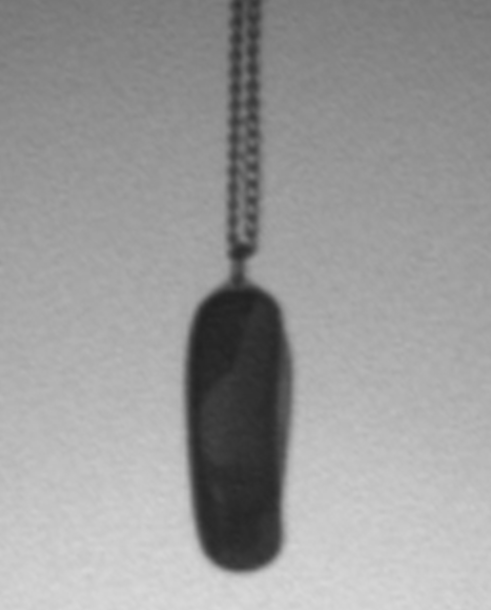 This stainless steel item has a decorative inlay and can be worn as a necklace or key chain. It actually has a knife inside and can pose a serious threat to law enforcement officers.