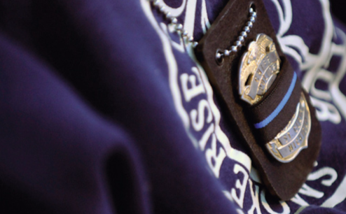 Police Badge on Draped Cloth with Seal