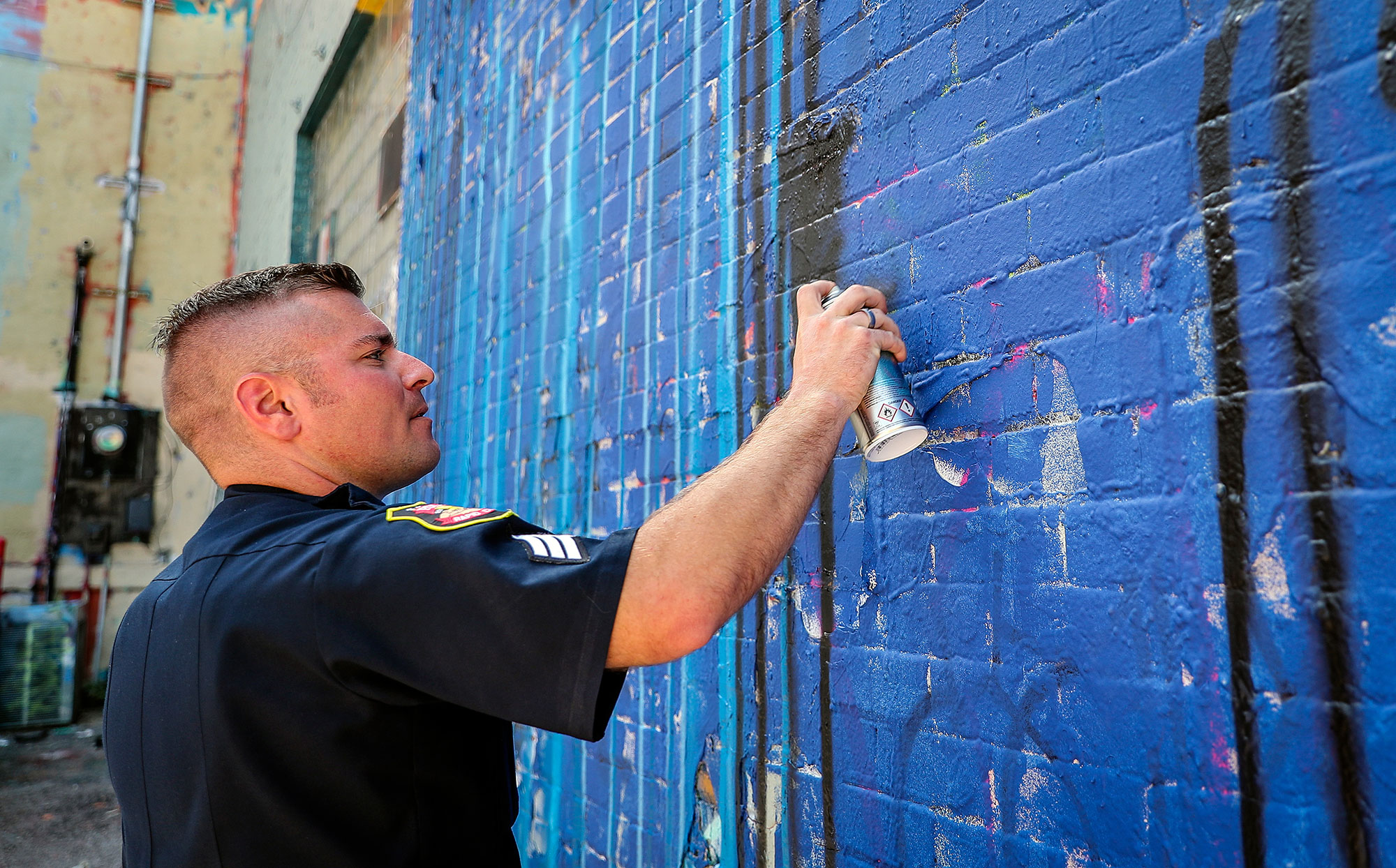 Police Officer with Spray Can