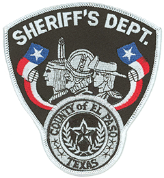 The patch of the El Paso County, Texas, Sheriff’s Department depicts three of the many cultures that settled the southwest—the American Indian, Spanish conquistador, and American cowboy. Bordering these representations are banners of the state of Texas’ Lone Star Flag and the seal of El Paso County. As part of the old wild west, El Paso played host to the likes of Pancho Villa, William Bonney (a.k.a. Billy the Kid), and John Wesley Hardin. Today the city and its neighbor across the border, Ciudad Juarez, Mexico, have developed into a modern and progressive region, forming the largest bilingual, binational workforce in the Western Hemisphere. 
