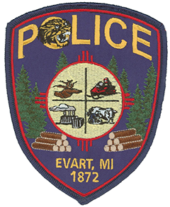  The Evart, Michigan, Police Department patch symbolizes the pride and heritage of the community it serves. The wildcat depicted at the top is the mascot of Evart High School. The center crest represents the economic strengths of the city—hunting, outdoor recreation, farming, and industry. Surrounding the crest is a tribute to Evart’s once-thriving logging industry, which was largely responsible for the city’s founding in 1872.