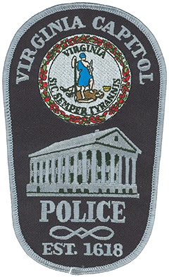 The Virginia Division of Capitol Police is the first organized policing agency in America. Its roots originate in 1618 at the first permanent English settlement in Jamestown. Based today in Richmond, the agency has evolved with the state’s seat of government over the past 396 years. The official seal of Virginia is depicted atop the agency’s service patch. The seal features a female figure representing virtue standing over a fallen male figure representing tyranny. The Latin inscription “Sic Semper Tyrannis” translates to “Thus Always to Tyrants.” The Virginia state capitol is depicted beneath the seal as it was originally designed by Thomas Jefferson in 1785. Jefferson modeled the building after the Maison Carrée, an ancient Roman temple in Nîmes, France.