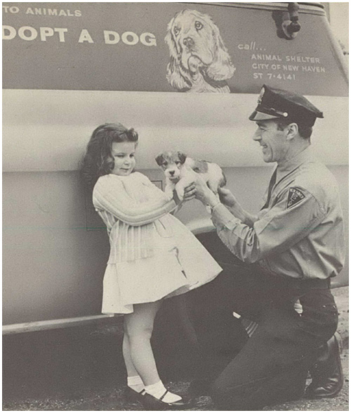 Photo from the Archives Officer with Girl and Puppy