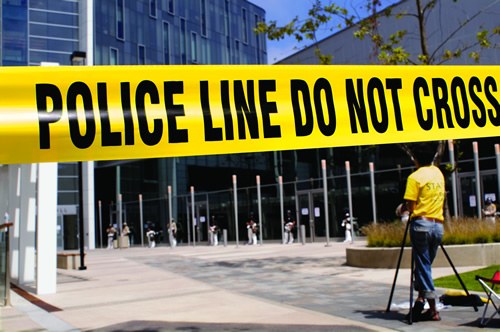 Police Line Tape in Front of Buildings