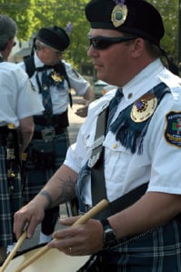 The Gates Keystone Club Police Pipes and Drums Band honors fallen comrades and participates in official ceremonial events.