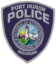 The Port Huron (Michigan) Police Department was established in 1881 and is nationally accredited by the Commission on Accreditation for Law Enforcement Agencies (CALEA). Its patch proudly depicts these achievements alongside the historic Fort Gratiot Lighthouse, the first of its kind in Michigan. Built in 1829, the lighthouse marks the channel into the St. Clair River from Lake Huron and is still active. Port Huron is considered the “Maritime Capital of the Great Lakes.”