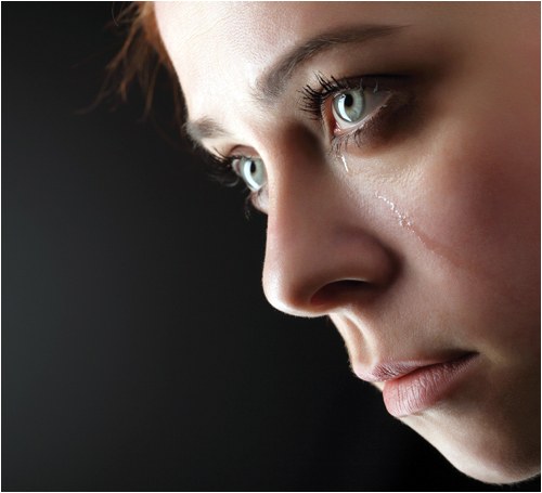 Profile of Young Woman Crying (Stock Image)