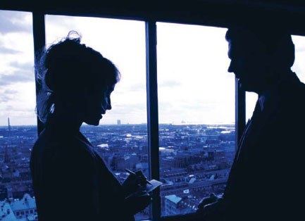 Profile Silhouettes of a Man and Woman in Front of a Window (Stock Image)
